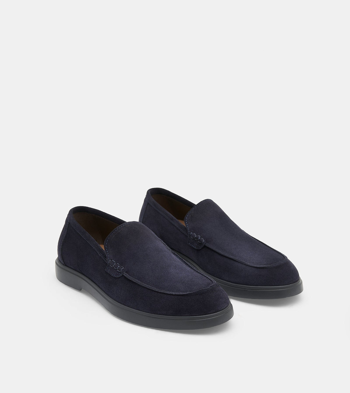 Men's navy slip-on loafers with almond toes and flat soles