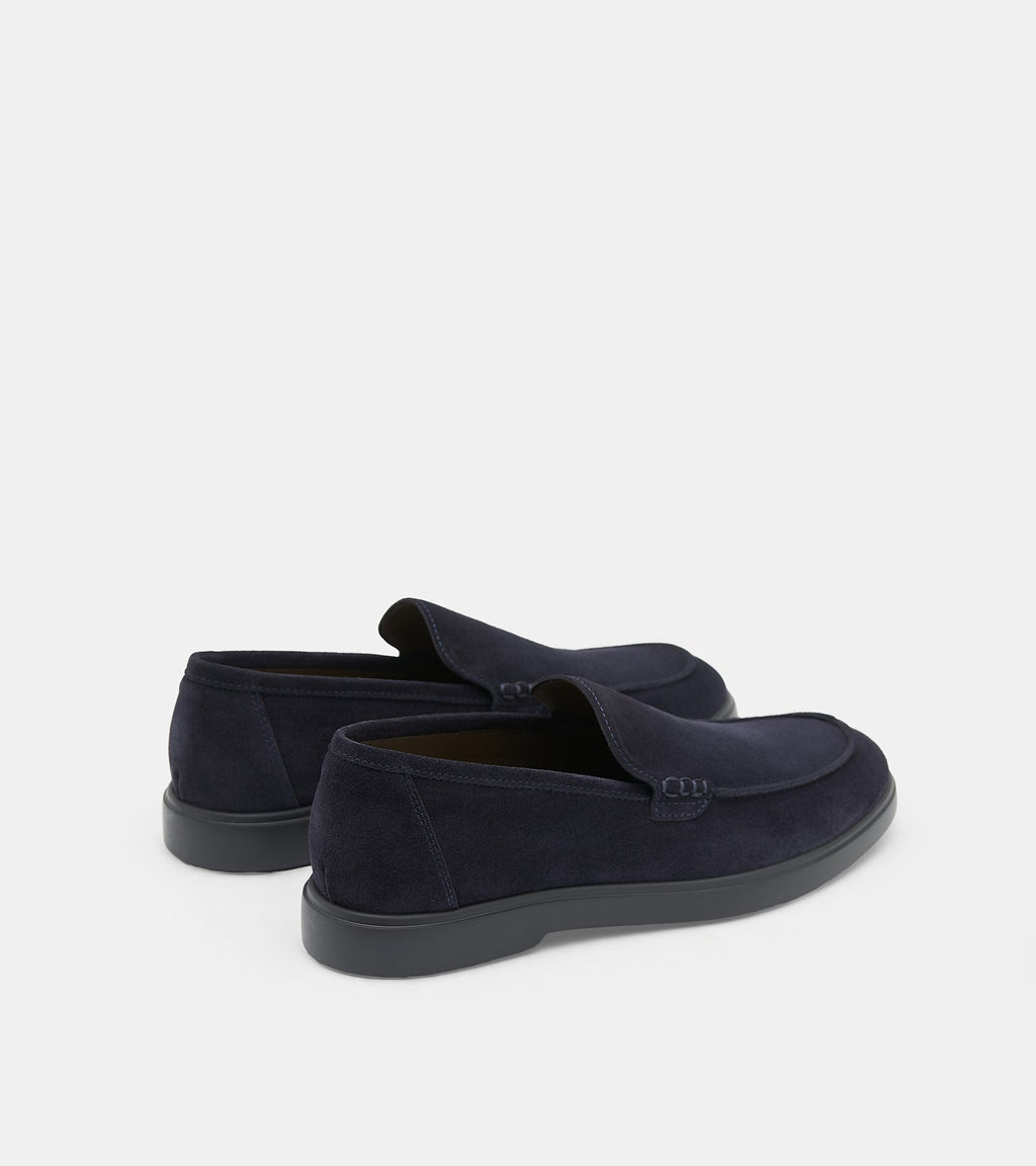 Men's navy slip-on loafers with almond toes and flat soles