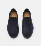 Men's navy slip-on loafers with almond toes and flat soles