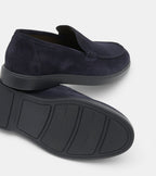 Men's navy slip-on loafers with almond toes and flat soles
