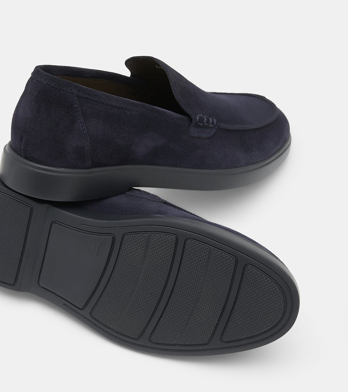Men's navy slip-on loafers with almond toes and flat soles