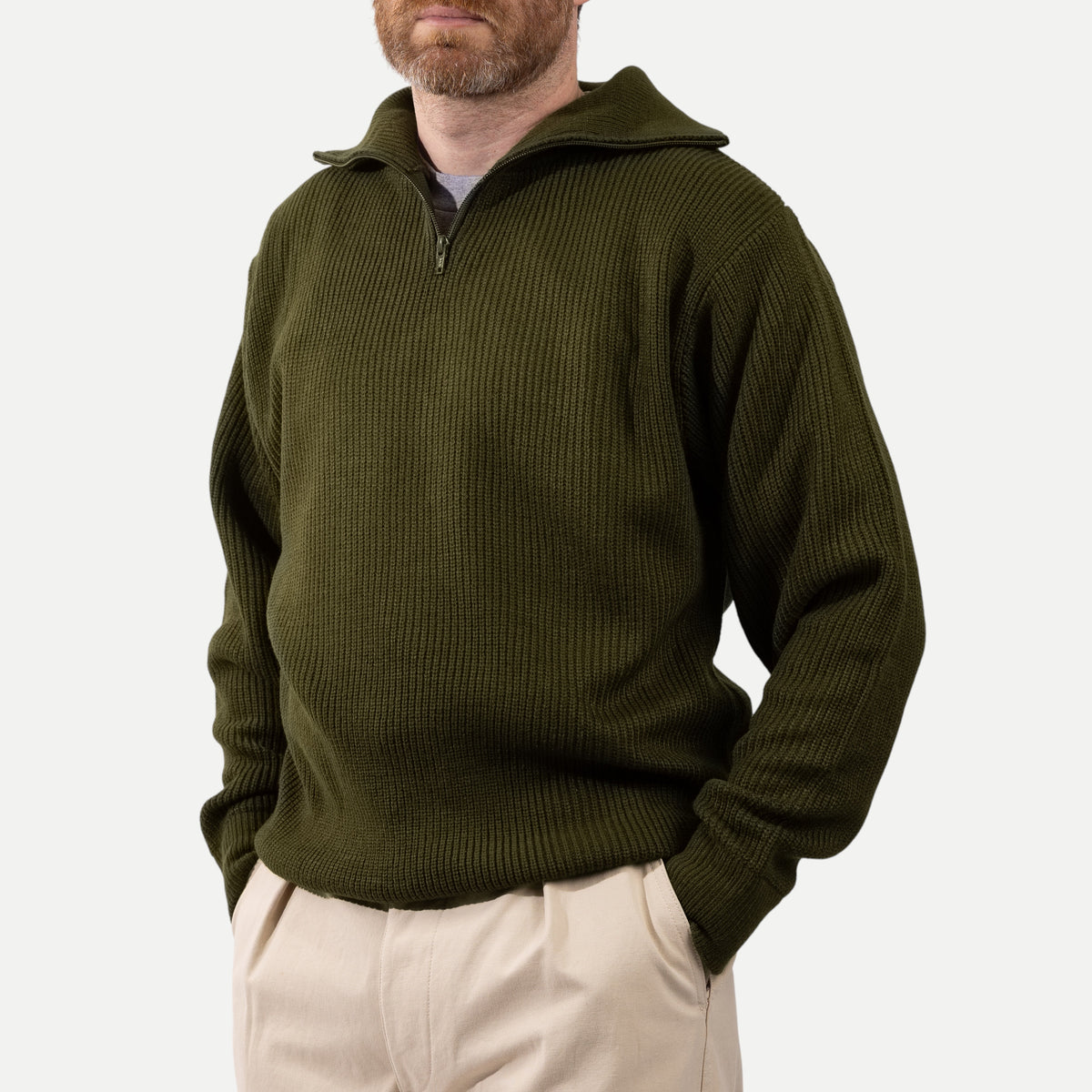 Men's olive green ribbed half-zip jumper with a high collar and long sleeves