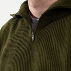 Men's olive green ribbed half-zip jumper with a high collar and long sleeves