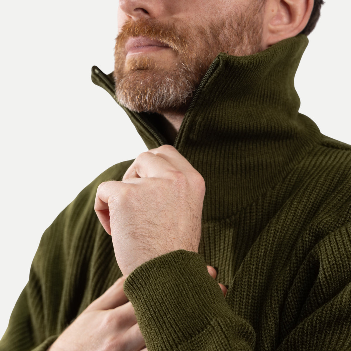 Men's olive green ribbed half-zip jumper with a high collar and long sleeves
