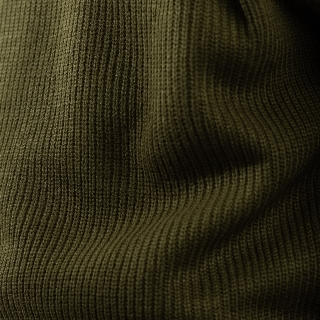 Men's olive green ribbed half-zip jumper with a high collar and long sleeves
