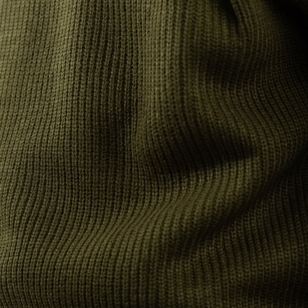 Men's olive green ribbed half-zip jumper with a high collar and long sleeves