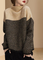 Women's turtle neck jumper with geometric chevron pattern and long sleeves