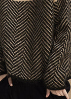 Women's turtle neck jumper with geometric chevron pattern and long sleeves