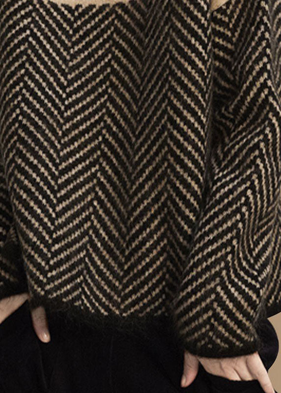 Women's turtle neck jumper with geometric chevron pattern and long sleeves