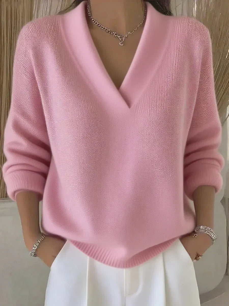 Women's pink V-neck sweater with long sleeves and ribbed trims