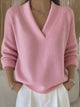 Women's pink V-neck sweater with long sleeves and ribbed trims