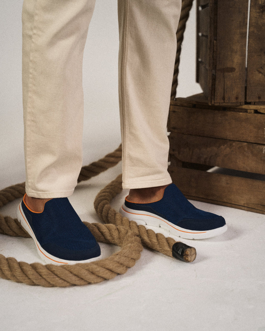 Unisex slip-on sneaker slides with textured upper and white segmented sole