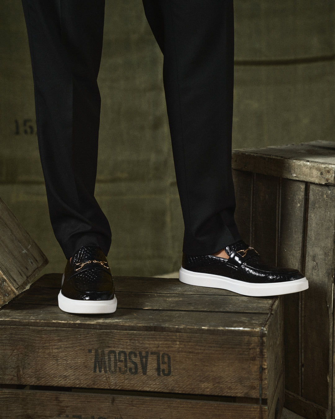 Embossed slip-on loafers with gold bit detail and flat contrasting soles