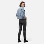 Women's light blue cropped denim jacket with lapel collar and zip pockets