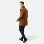 Men's long coat with stand collar, zip and button front, and multiple pockets