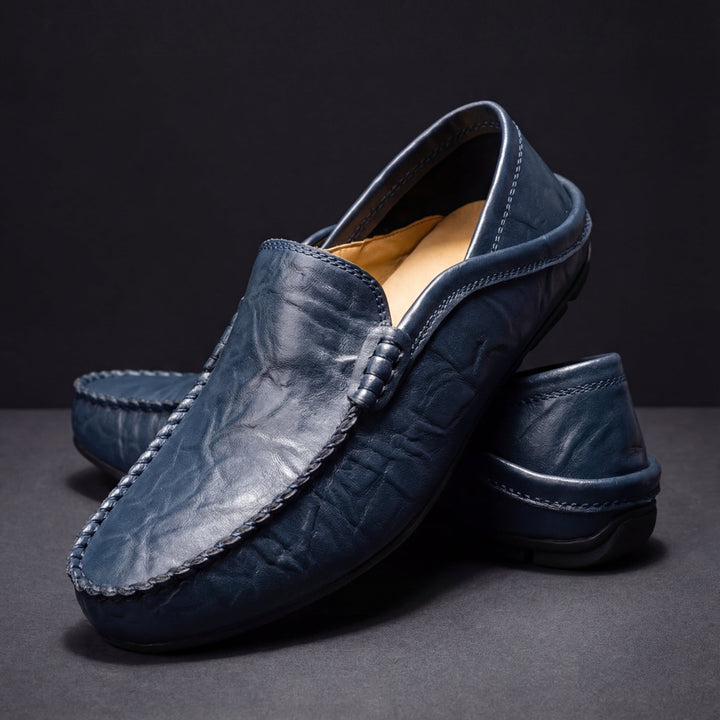 Moc toe slip-on loafers with stitched edging and low-profile sole