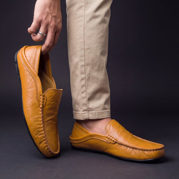 Moc toe slip-on loafers with stitched edging and low-profile sole