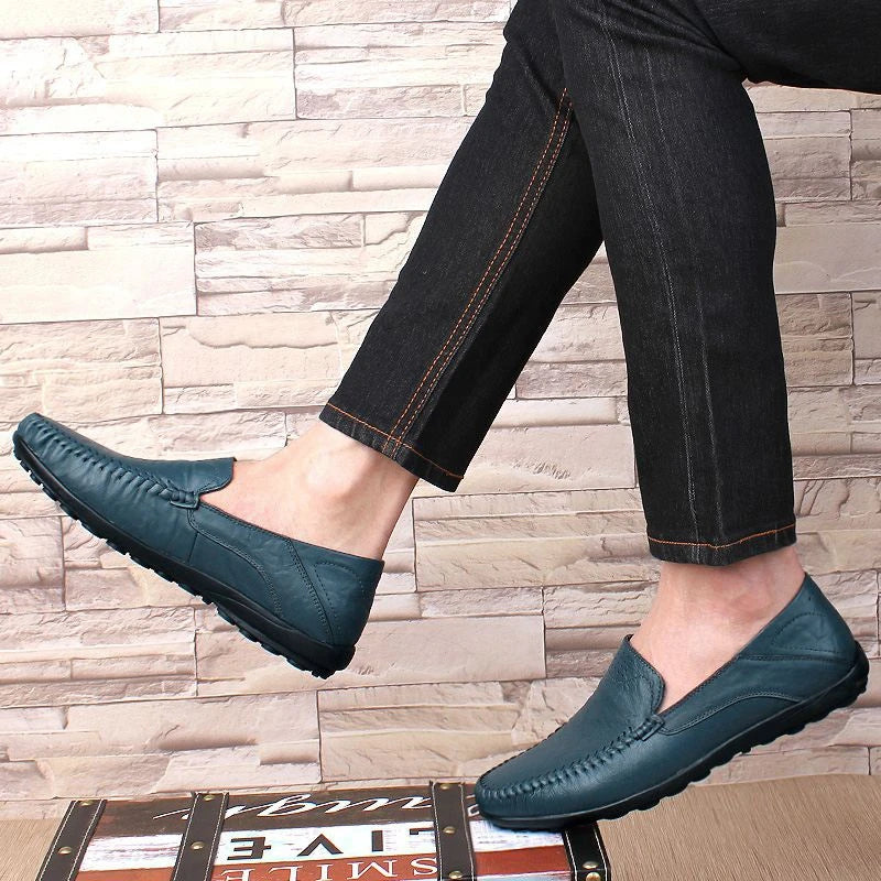 Men's slip-on leather loafers with rounded moc toe and stitched detailing
