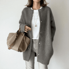 Women's longline button front cardigan with round neckline and long sleeves