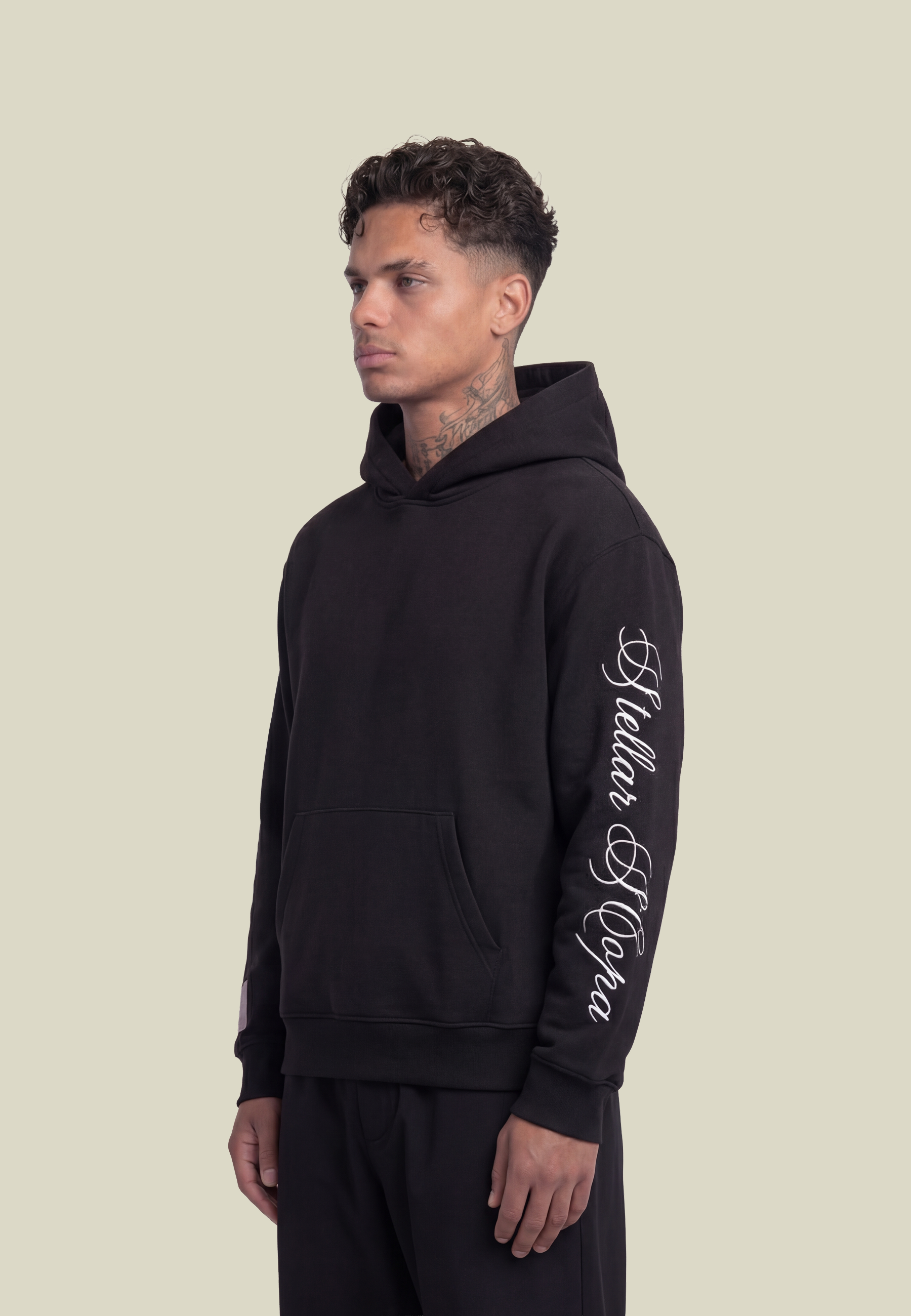 Black unisex pullover hoodie with sleeve lettering