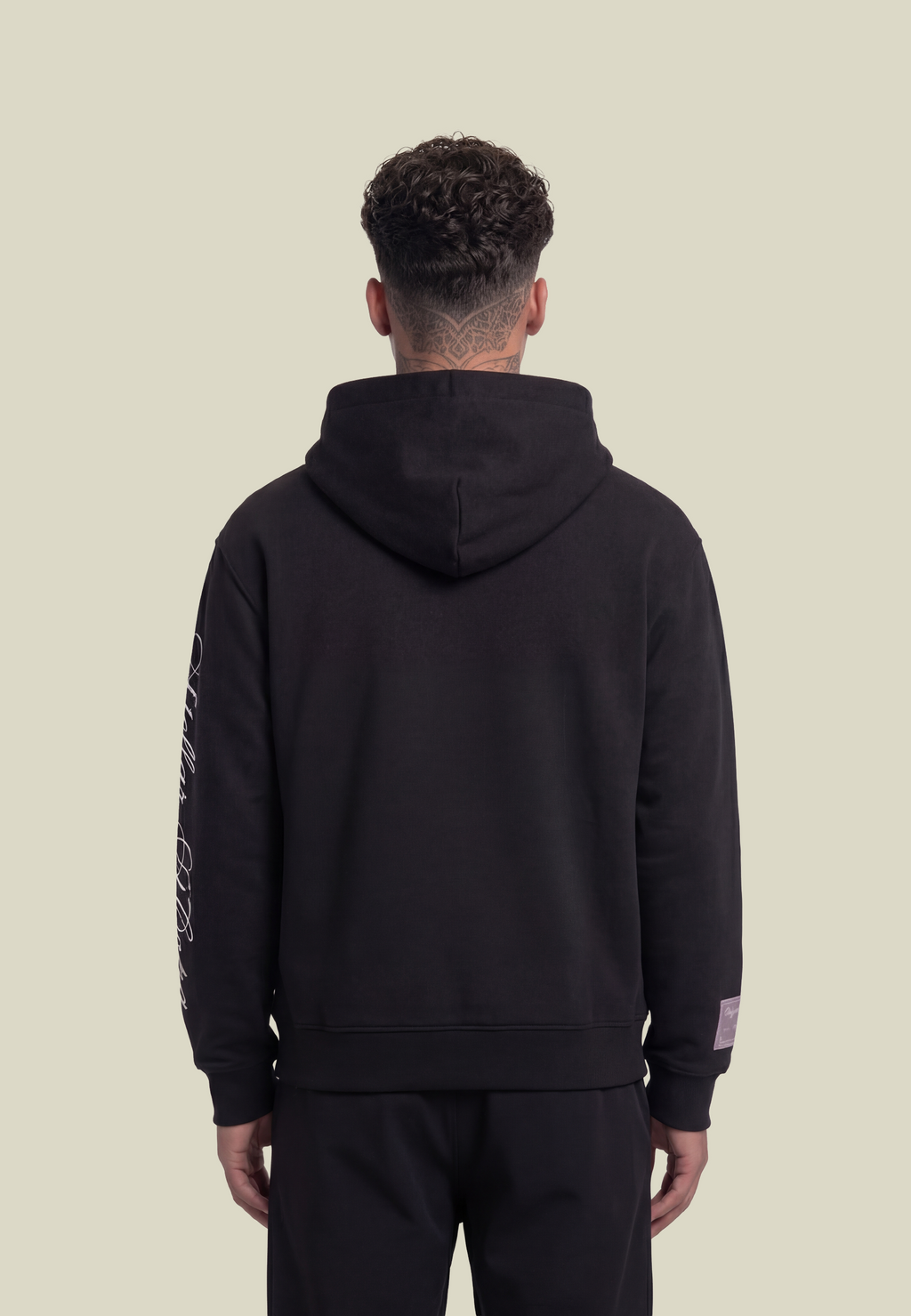 Black unisex pullover hoodie with sleeve lettering