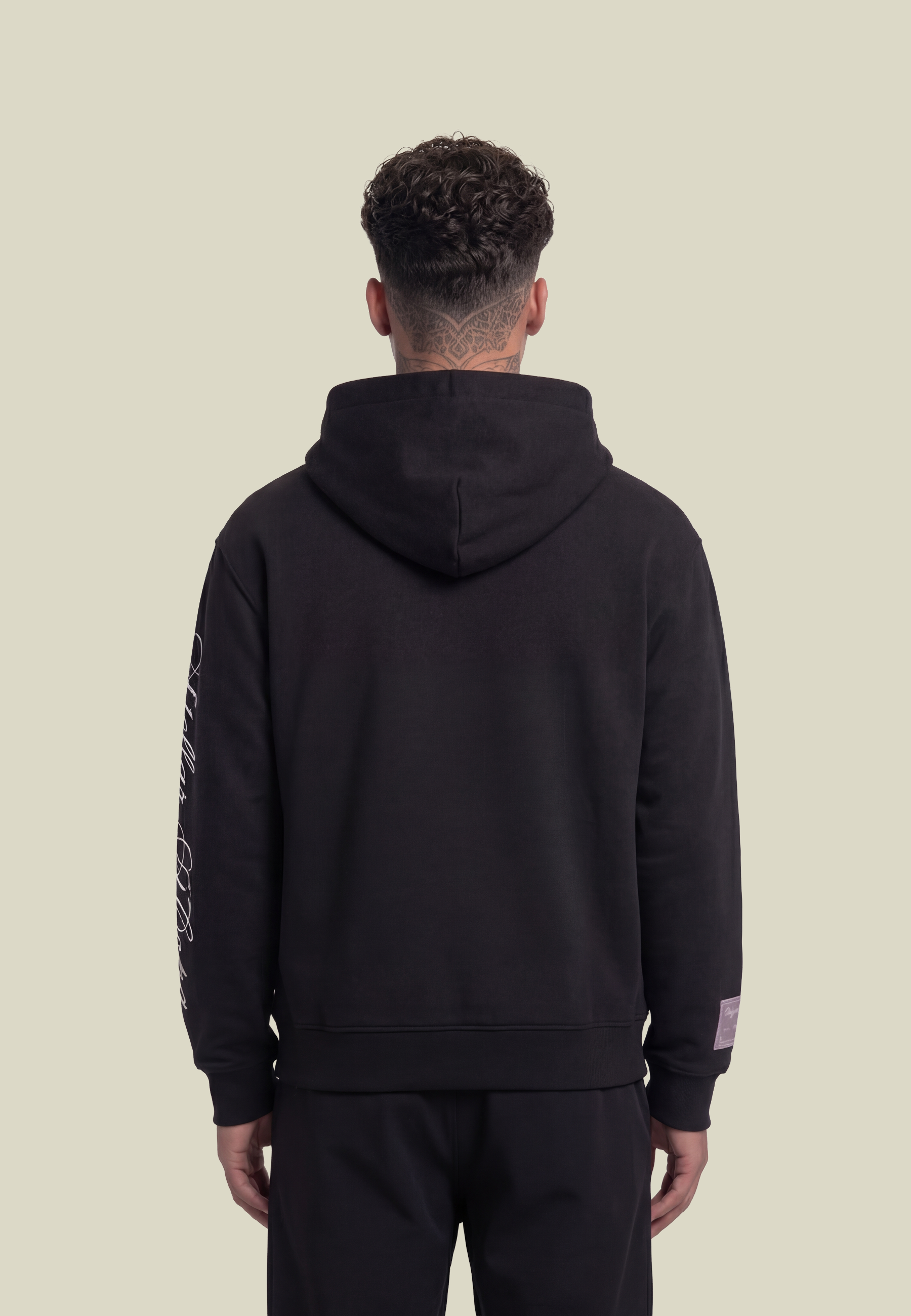 Black unisex pullover hoodie with sleeve lettering