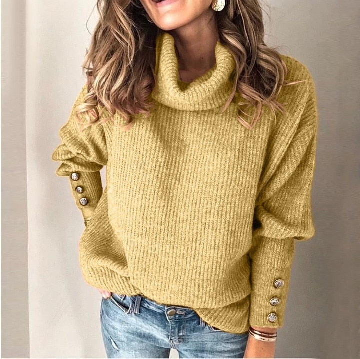 Women's ribbed turtleneck pullover with button cuff details
