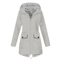 Women's hooded trench coat with long sleeves, zip front and flap pockets