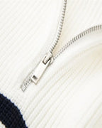 Striped ribbed knit sweater with mock neck and quarter zipper