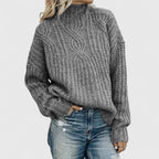 Women's cable knit sweater with mock neck and long sleeves