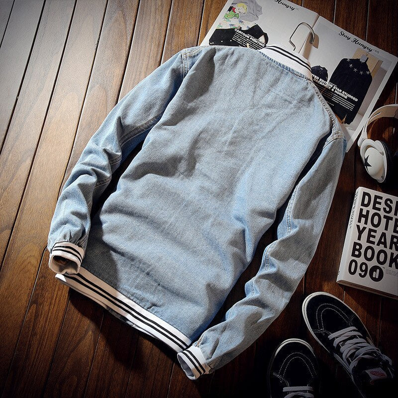 Men's light blue denim jacket with button front and ribbed trims
