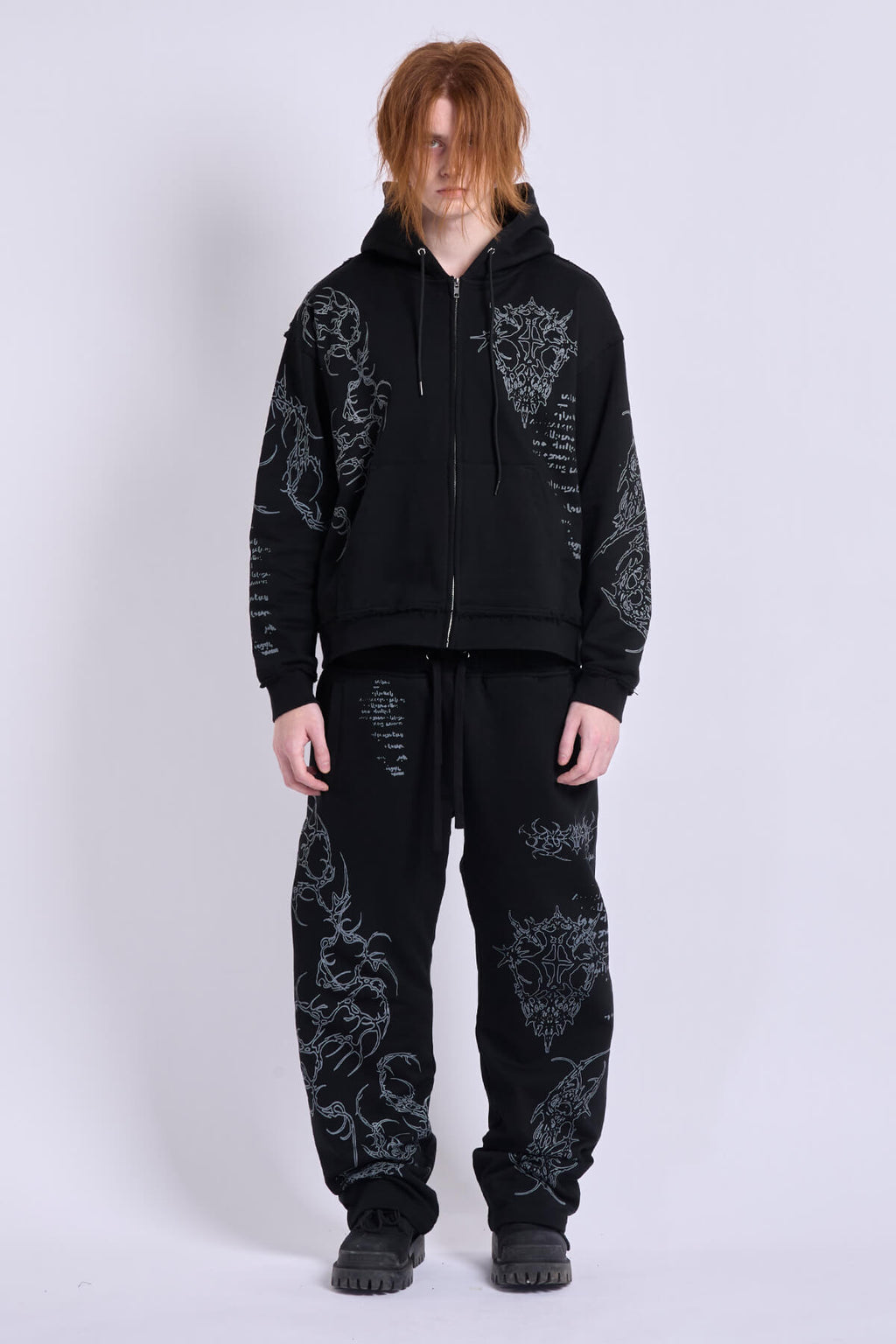 Black graphic zip hoodie with drawstring hood and long sleeves