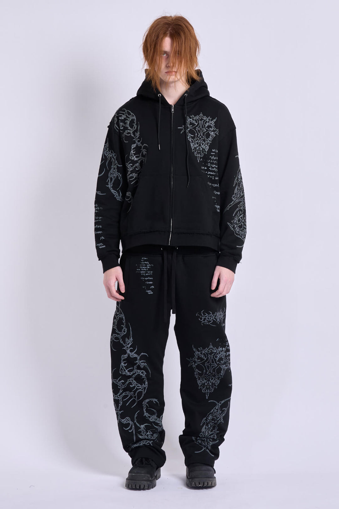 Black graphic zip hoodie with drawstring hood and long sleeves