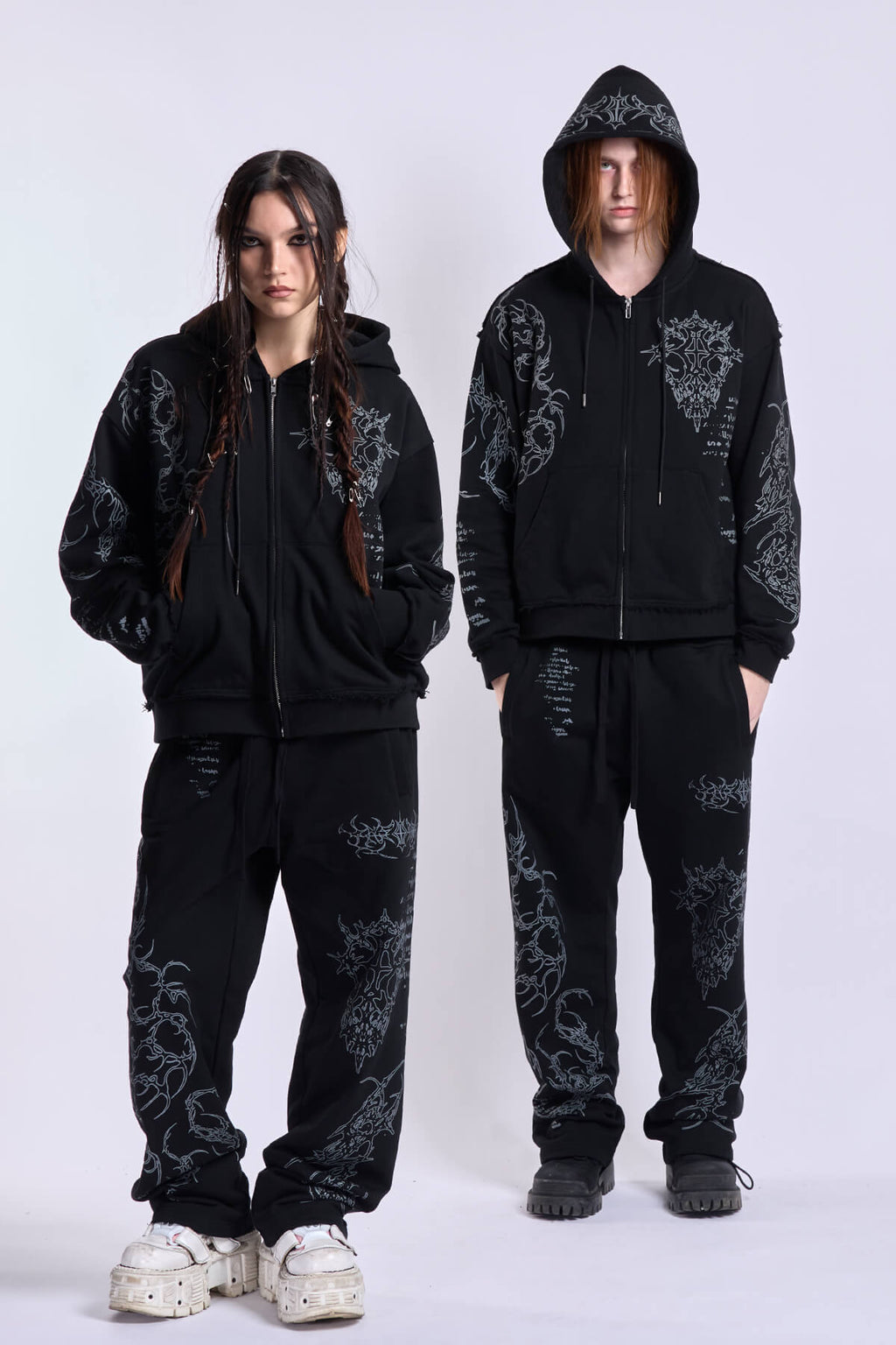 Black graphic zip hoodie with drawstring hood and long sleeves