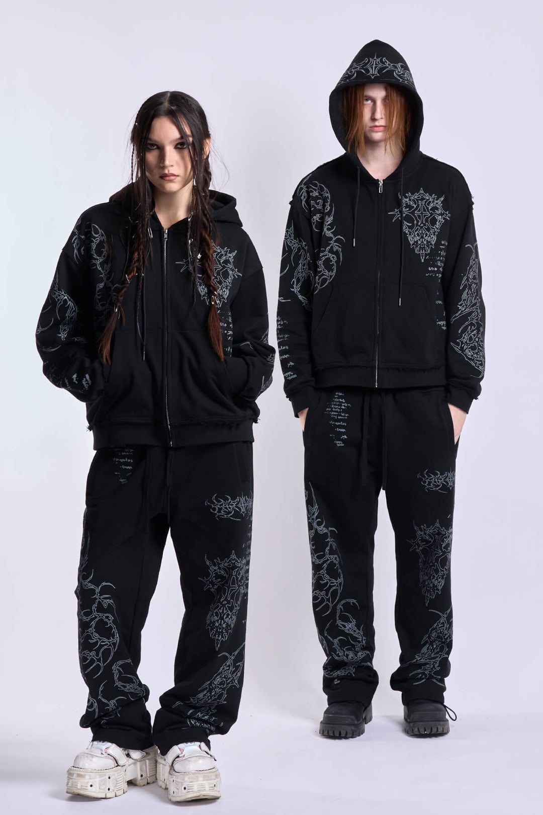 Black graphic zip hoodie with drawstring hood and long sleeves