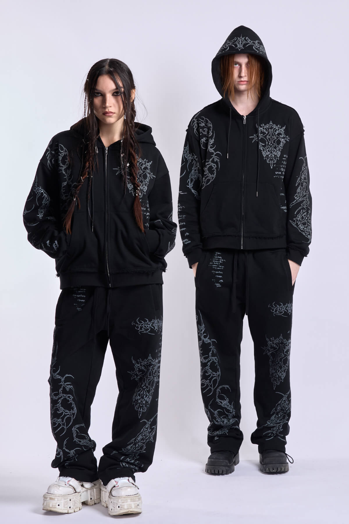 Black graphic zip hoodie with drawstring hood and long sleeves