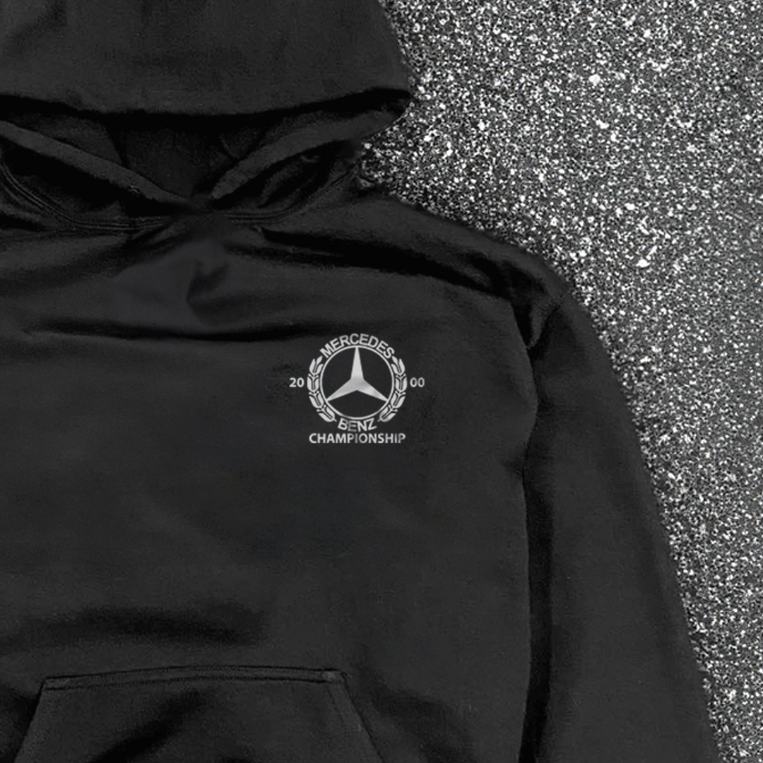 Black hooded hoodie with white Mercedes-Benz Championship chest logo and front kangaroo pocket