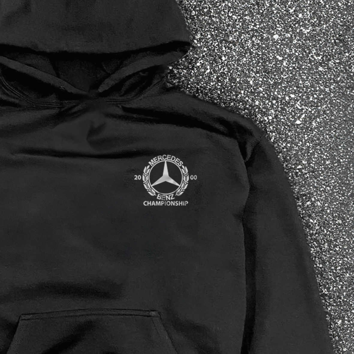 Black hooded hoodie with white Mercedes-Benz Championship chest logo and front kangaroo pocket