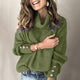 Women's ribbed turtleneck pullover with button cuff details