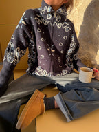 Women's paisley knit cardigan with zip front and high collar