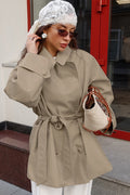Women's khaki double-breasted trench coat with rounded collar and tie belt