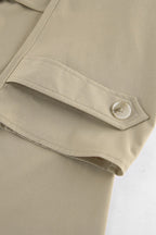 Women's khaki double-breasted trench coat with rounded collar and tie belt