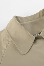 Women's khaki double-breasted trench coat with rounded collar and tie belt
