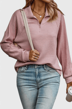 Women's ribbed quarter-zip sweater with long sleeves and raised collar