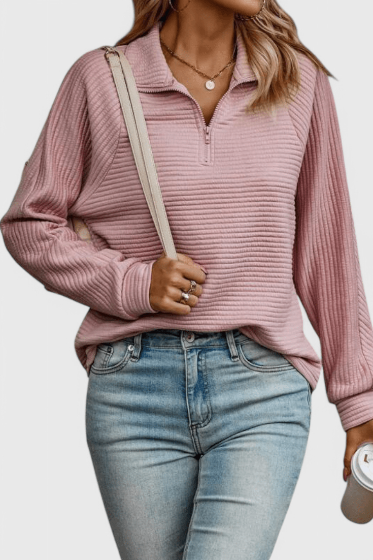 Women's ribbed quarter-zip sweater with long sleeves and raised collar