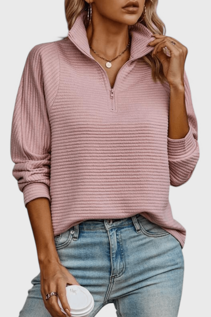Women's ribbed quarter-zip sweater with long sleeves and raised collar