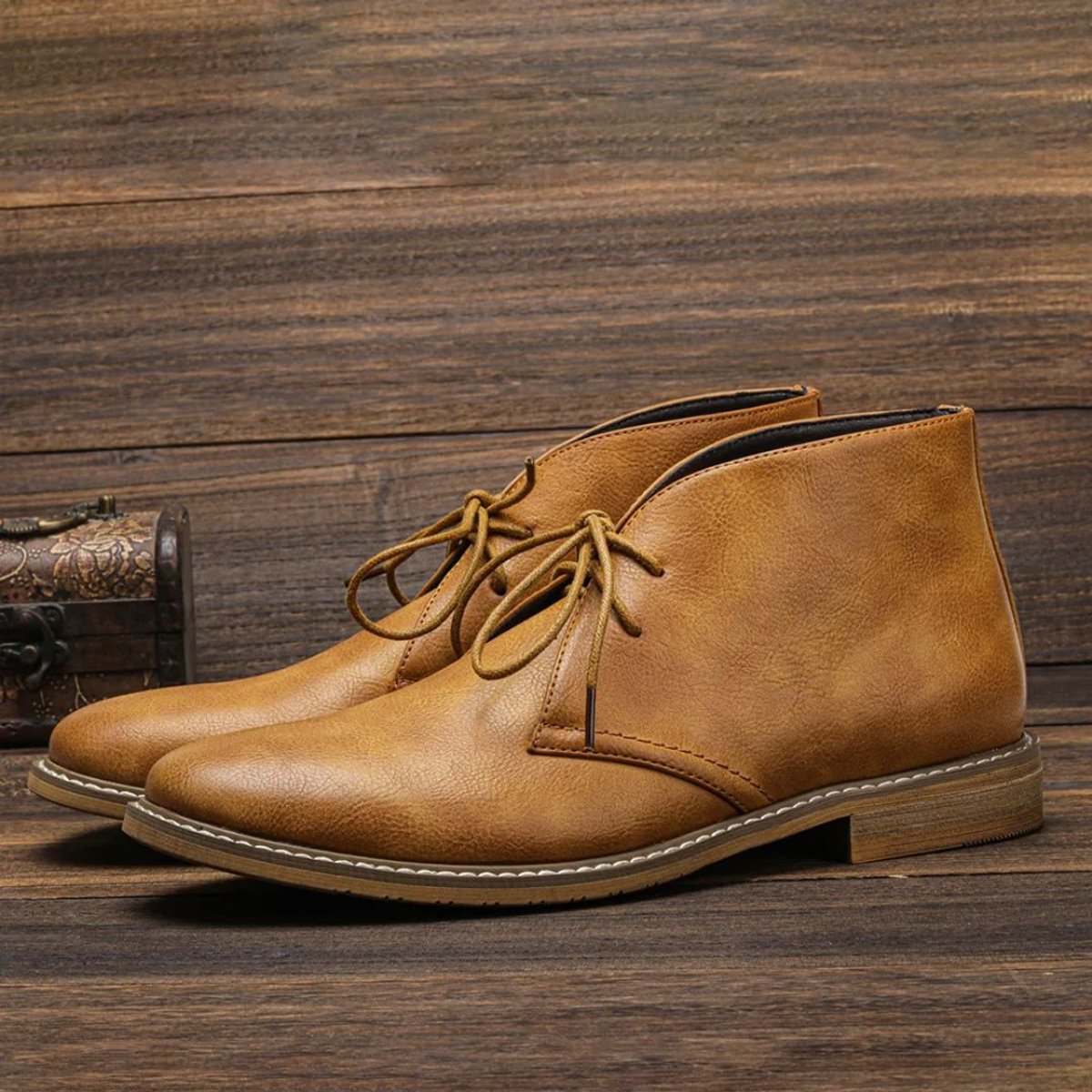 Men's chukka boots with lace-up front, rounded toe and low heel