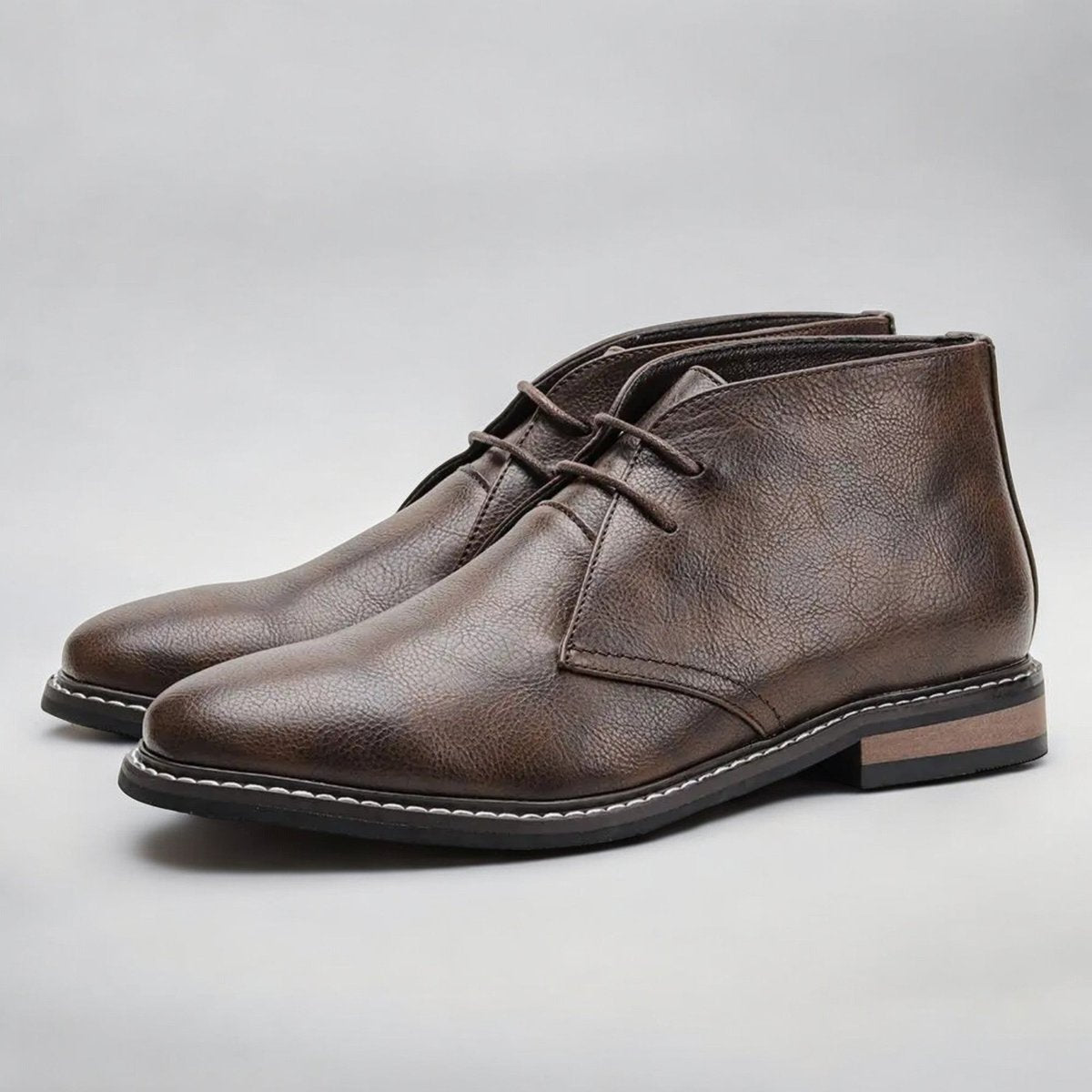 Men's chukka boots with lace-up front, rounded toe and low heel