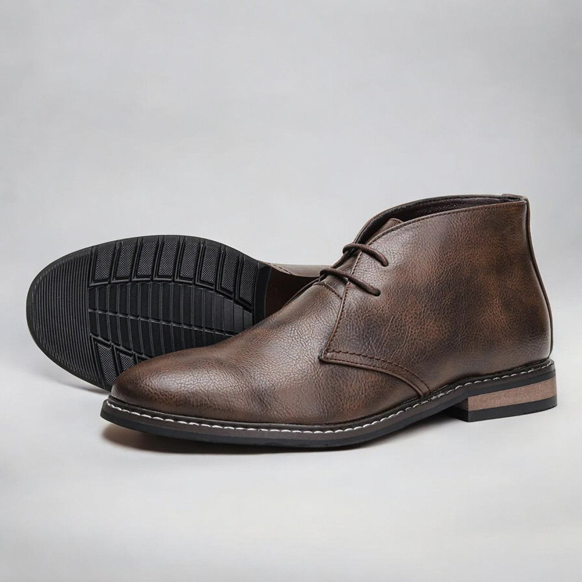Men's chukka boots with lace-up front, rounded toe and low heel