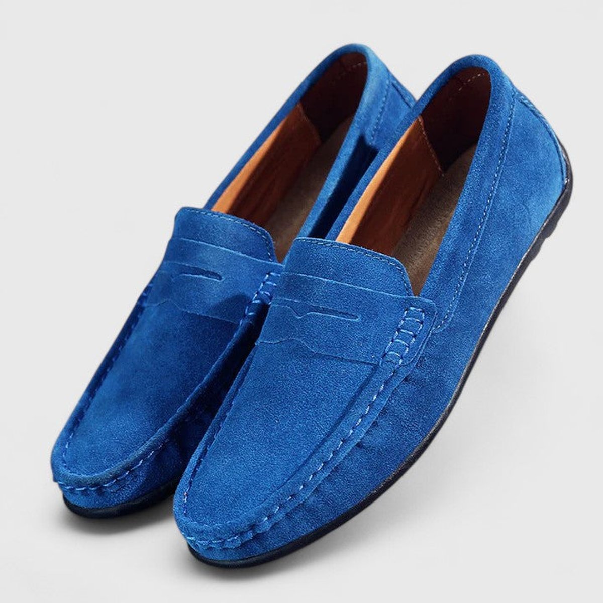 Men's blue penny loafers with moc toe stitching